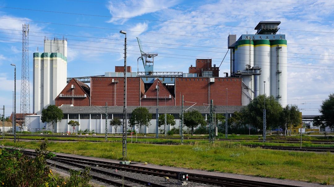Cordillera industrial manufacturing complex with silos and rail access